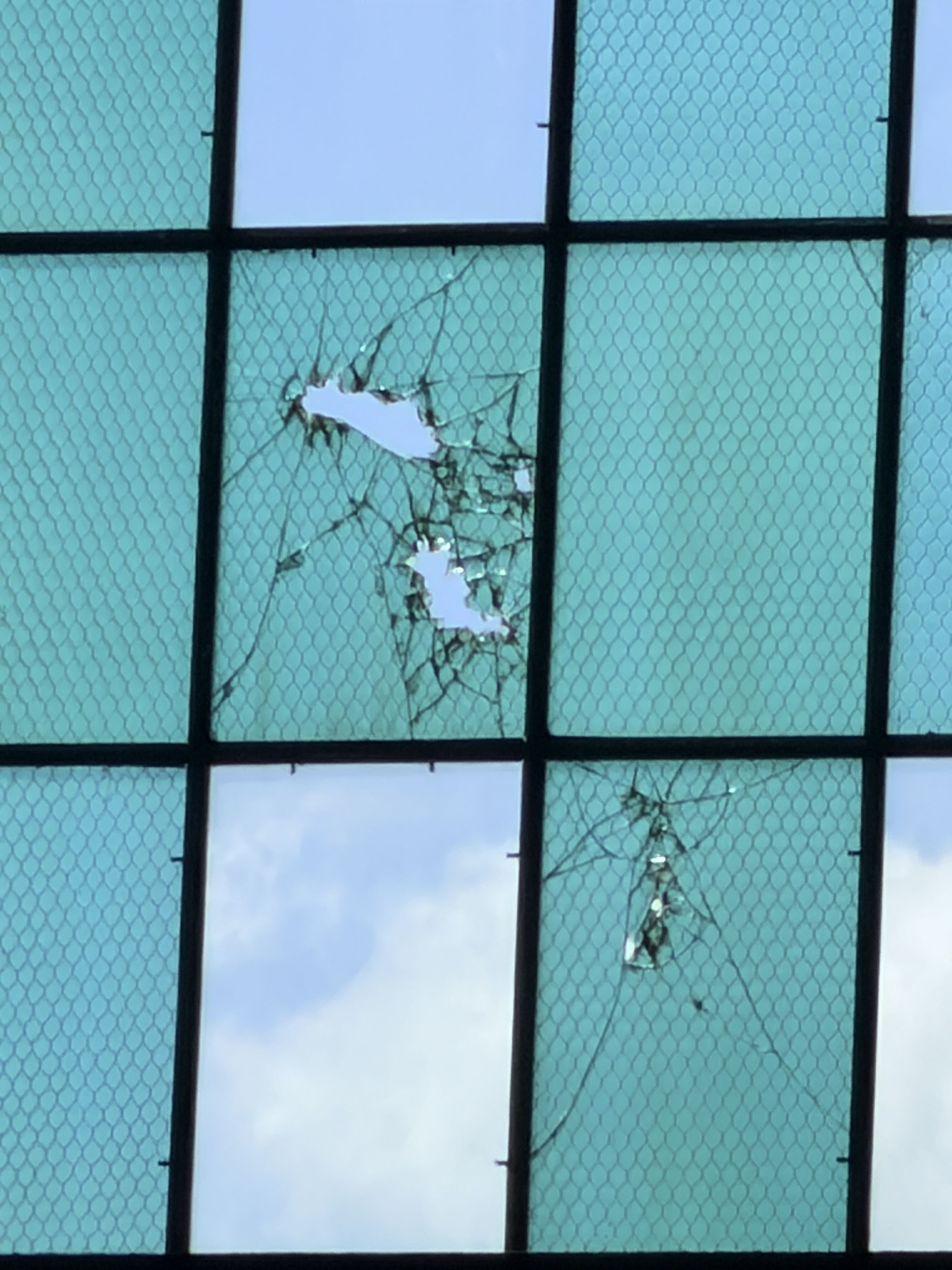 Bullet holes in the hangar windows